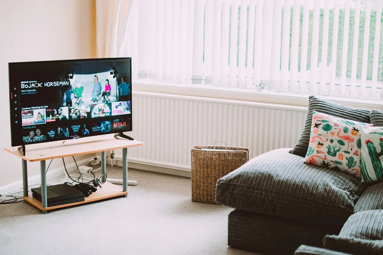 apollo group tv sports - streaming media player beside television